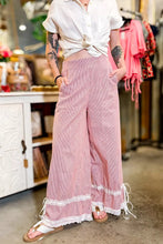 Pink striped wide-leg pants with stripe contrast lace trim and ribbon tie side details for stylish comfort
