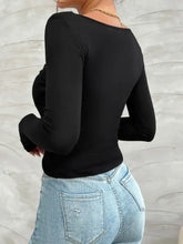 Devine Twisted long sleeve black V-neck bodysuit with distressed jeans