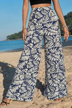 Navy blue and cream leaf print wide leg pants with a flowy fit for stylish casual wear