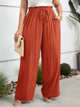 Cropped rust orange plus size high waist wide leg pants with elastic waistband and drawstring for comfortable wear