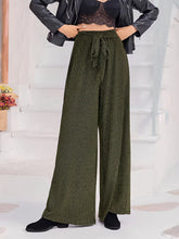 Olive green ribbed wide-leg pants with high waist tie and drawstring waist for a comfortable fit