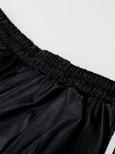 Black satin gathered elastic waistband skirt paired with striped wide-leg pants suitable for tumble dry care