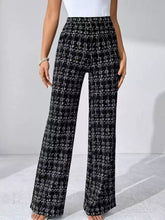Black and white plaid wide-leg pants with high waist and checkered pattern for a stylish look
