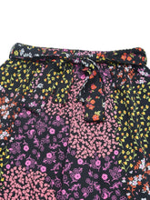 Black floral print high rise wide leg pants with tied waistband and multicolored flower patterns