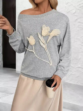 Gray floral applique off-the-shoulder sweatshirt with cream tulip appliqués, slightly stretchy, machine wash cold