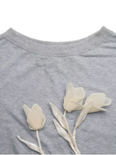 Gray heathered floral applique boat neck sweatshirt with delicate white tulip appliqués slightly stretchy machine wash cold