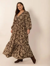 Brown floral balloon sleeve maxi dress with ruffled hem and cinched waist