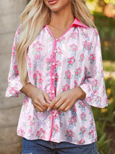 Pink floral collared ruffled half sleeve shirt with satin sheen pink buttons and ruffled cuffs