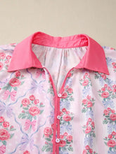 Pink floral collared ruffled half sleeve shirt with bright pink collar and matching button placket design