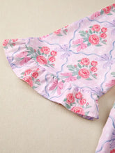 Pink floral collared ruffled half sleeve shirt with rose and bow patterns on light pink ruffled half sleeve fabric