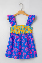 Bright blue and pink floral print sleeveless top with yellow smocked waistband and flutter straps for a flowy fit