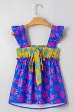 A vibrant blue and pink floral colorblock sleeveless tank top with flutter straps and a yellow tie-waist detail