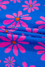 Floral colorblock flutter straps flowy tank top in vibrant blue fabric with bold pink daisy patterns and orange centers