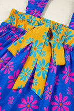 Floral colorblock flutter straps flowy tank top in vibrant blue and yellow with pink blossoms and a gathered waistband bow