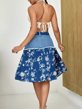 Blue denim skirt with white floral embroidery and frayed hem detail in a floral denim skirt style