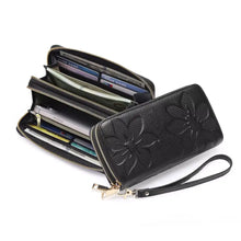 Floral Embossed Leather Zipper Wallet in black with gold-tone accents