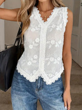 White sleeveless lace trim tank with floral embroidered lace details and scalloped edges for elegant wear