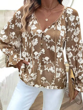A brown long sleeve shirt with white floral embroidered lace and bell sleeves ideal for elegant wear