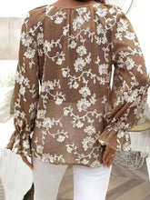 A brown floral embroidered long sleeve shirt with intricate white embroidery and sheer mesh fabric
