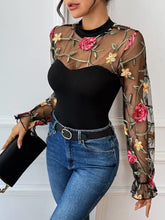 Black sheer floral embroidered mesh long sleeve bodysuit with pink and yellow flowers and long sleeves