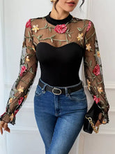 Black floral embroidered mesh long sleeve bodysuit with pink and yellow roses for elegant layering