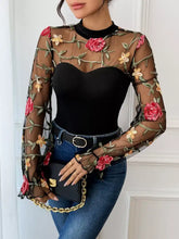 Black sheer mesh long sleeve bodysuit with embroidered red and yellow roses along sleeves and neckline