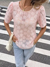 A delicate pink floral embroidered pearl trim lace blouse with puffed sleeves and round neckline