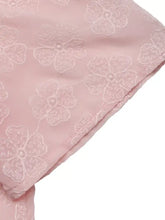 A delicate pink floral embroidered pearl trim blouse made of fabric with subtle matching light tone embroidery
