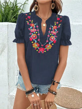 Navy blue short-sleeved blouse with vibrant floral embroidered puff neckline and shoulders for elegant wear