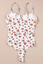 White one-piece swimsuit with floral frilled trim and delicate trim spaghetti straps in vibrant orange red and green pattern