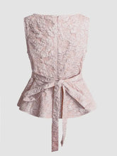 Floral jacquard peplum tank with delicate blush pink lace, fitted bodice, and tied waistband for elegant wear
