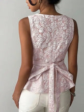 Delicate pink floral jacquard peplum tank with lace sleeveless design and matching tied waistband