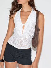 White floral lace halter neck cami with deep v-neckline and delicate floral pattern for elegant summer wear