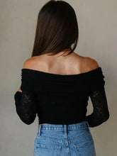 Black floral lace off-shoulder long sleeve slim top with elegant lace sleeves for a stylish look