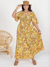 Floral maxi short sleeve slit dress with smocked waist and bell sleeves