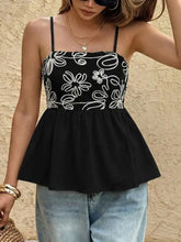 Black embroidered floral peplum cami with thin straps featuring intricate floral peplum design for elegant wear