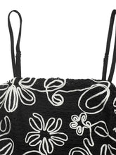 Black lace floral peplum cami with white embroidered floral patterns and thin straps in elegant design