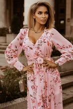 Floral pink maxi dress with long sleeve bishop sleeves and deep V-neck