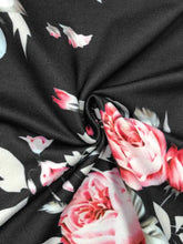 Black fabric floral print basic style tank top with vibrant pink and white roses and green leaves pattern