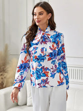 Floral print blouse with ruffled long sleeve length and tie neck