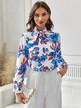 Floral print blouse with ruffled sleeves and tie neck long sleeve length