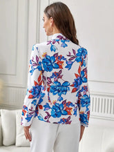 Floral print blouse with ruffled long sleeve length on white background