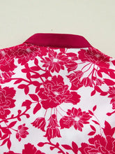 White blouse with bold red floral print, flutter sleeve, satin collar, color block trim, and lace v neck detail