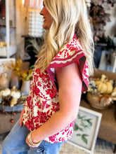 Red and cream floral print top with lace detail and flutter sleeve ruffled design for elegant casual wear