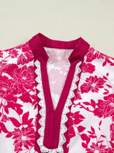A vibrant pink and white floral print blouse with flutter sleeves, magenta collar, and lace trim at the neckline