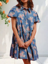 Blue denim floral print dress with pink and white rose pattern short sleeves button front and tiered skirt