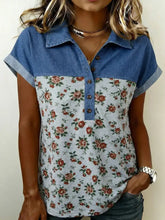 Floral print denim patchwork blouse featuring short sleeves and button-down front in denim and floral print design
