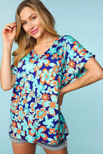 Woman in Haptics Floral Drop floral print V-neck top with denim shorts