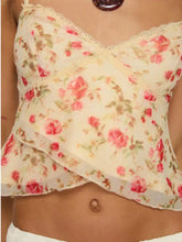A cream floral print lace trim cami with pink roses green leaves lace trim and layered ruffled hem