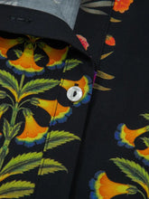 Black floral print lace trim frilled v neck short sleeve shirt with vibrant orange and green bell-shaped flowers